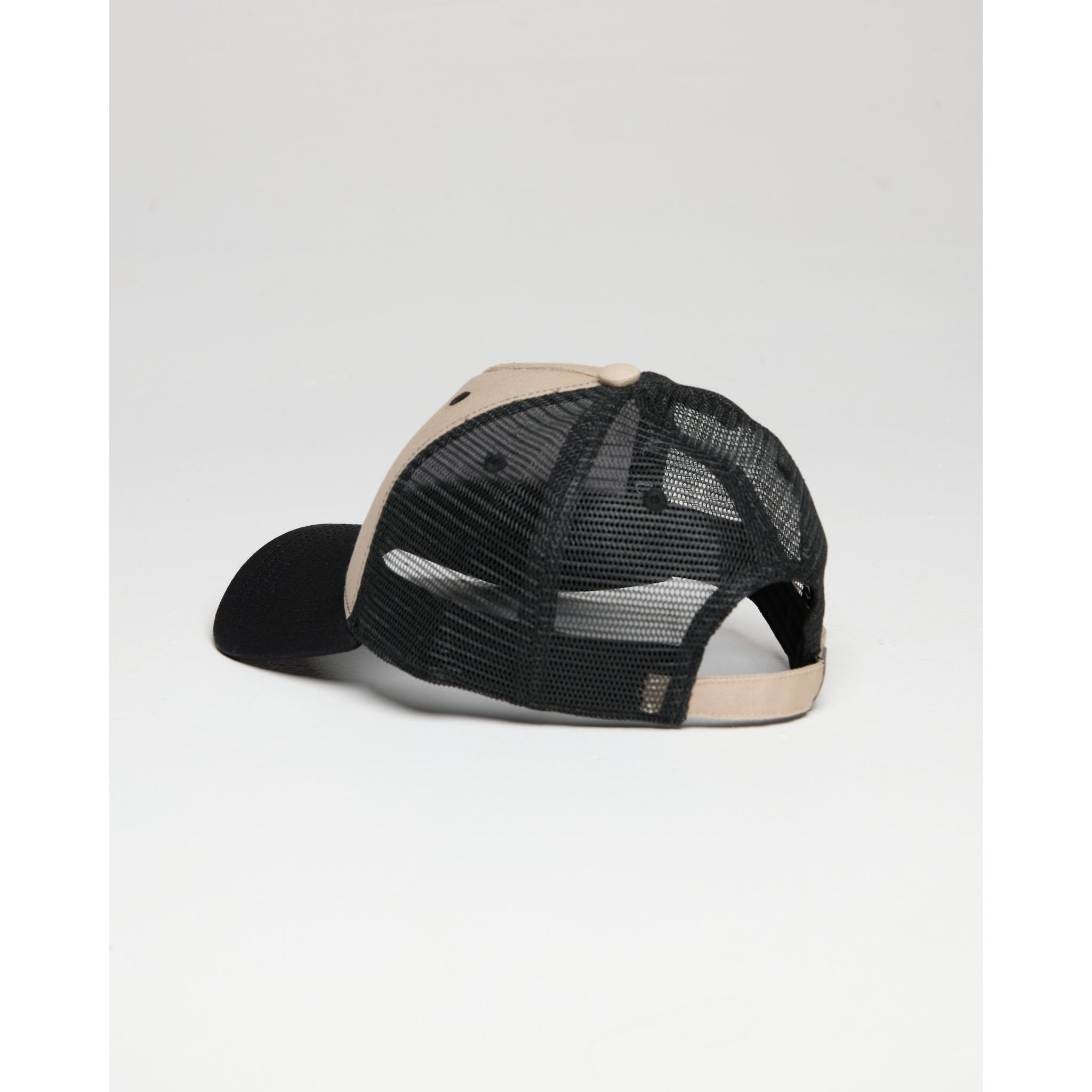 Black and beige cap with mesh back on a white background