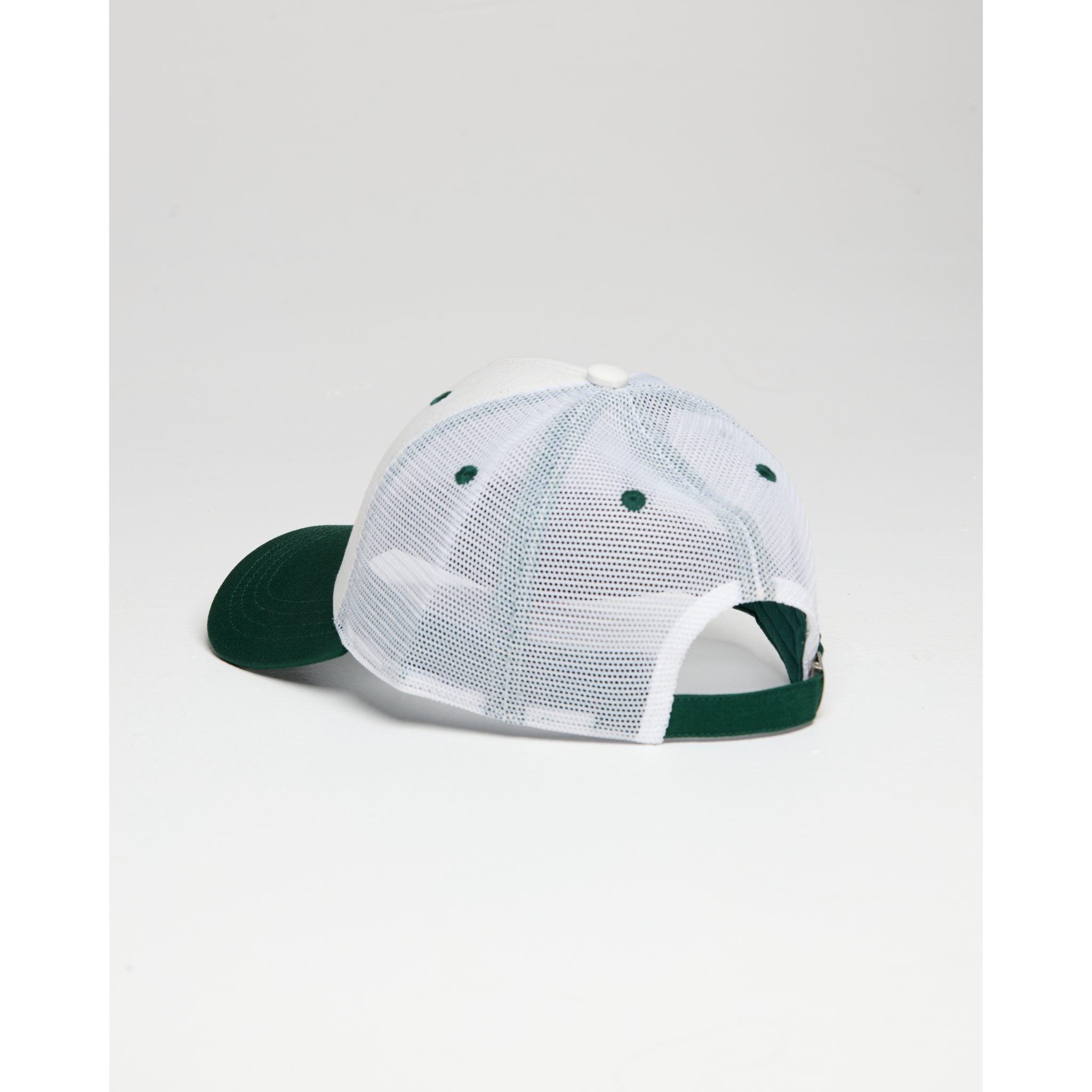Trucker cap with green brim and white mesh back on a light gray background