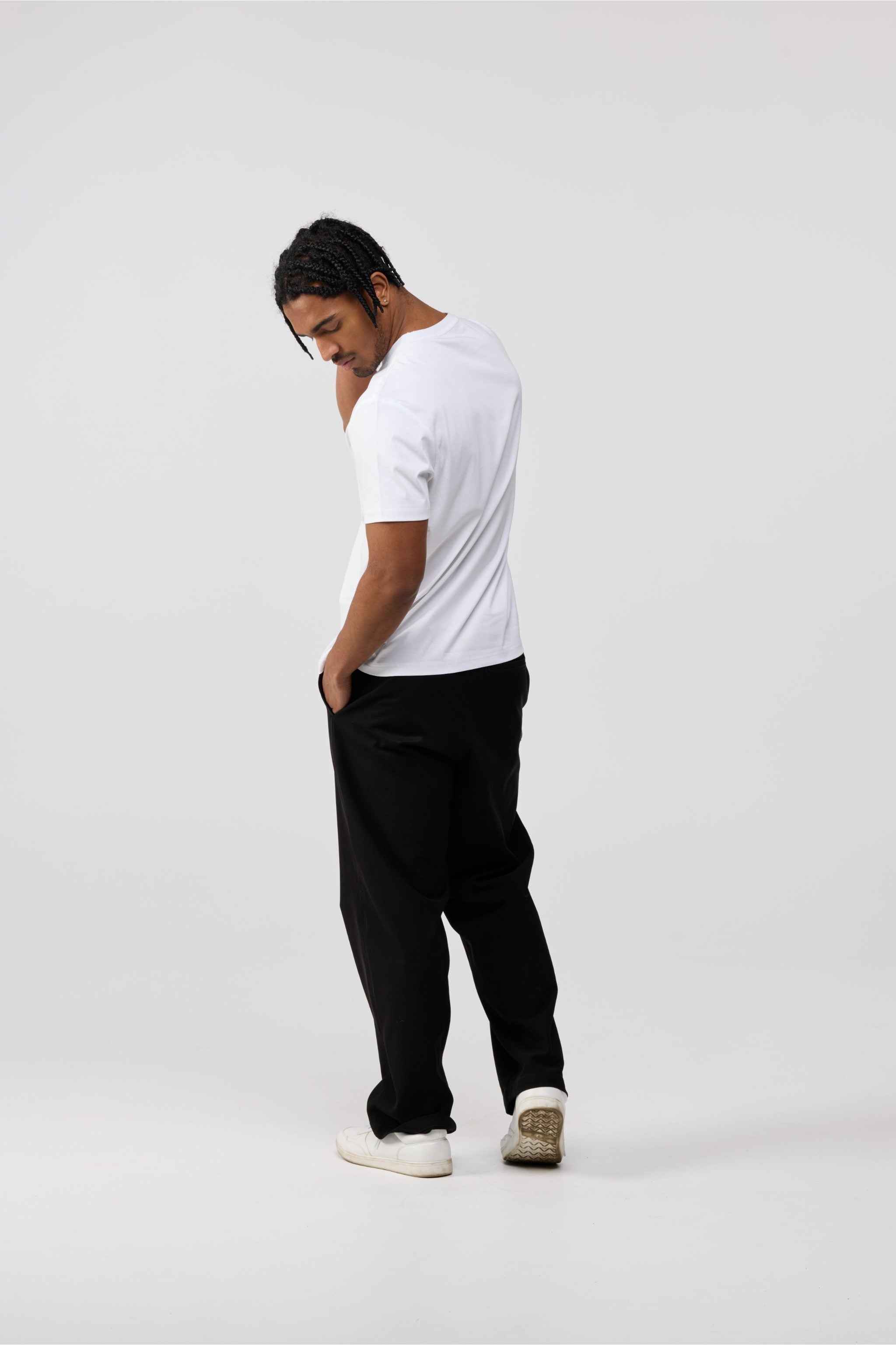 Back view of men’s white cotton crewneck t-shirt with solid white finish.