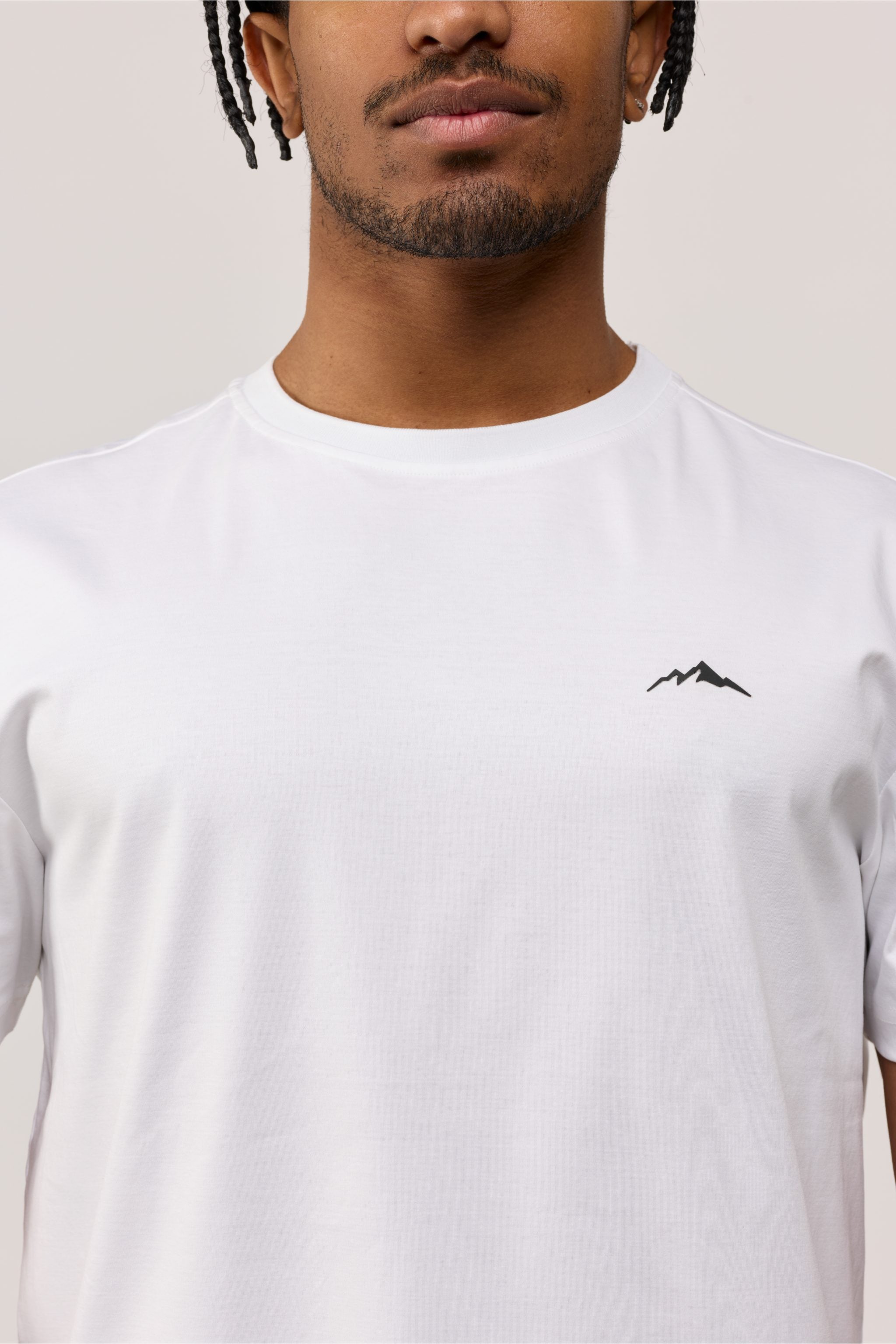 Close-up of front chest area showing fine stitching and breathable cotton fabric texture.