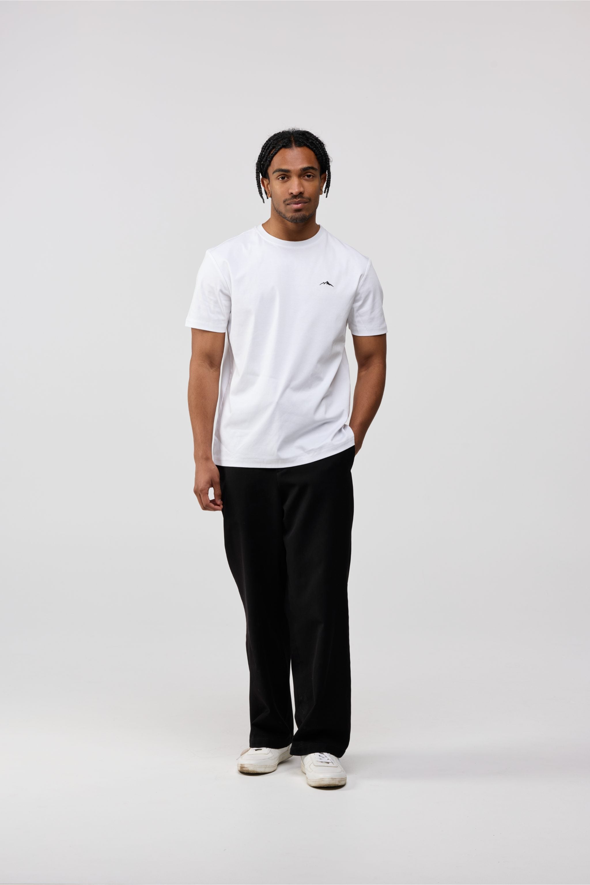 Model wearing men’s white cotton crewneck t-shirt