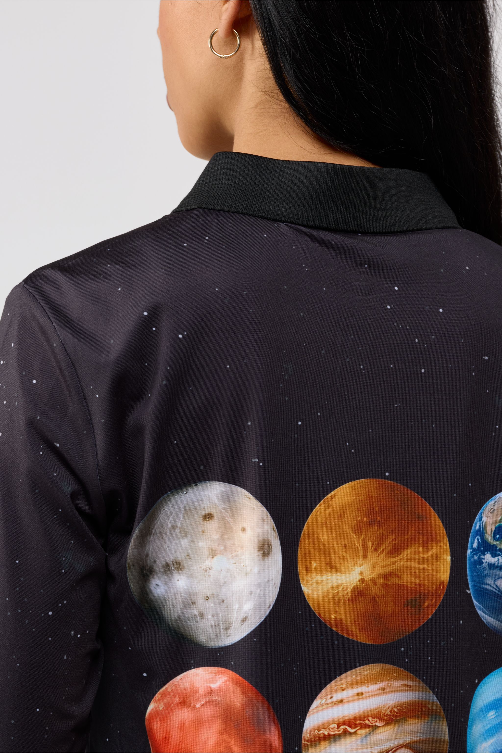 Close-up of front chest area of Solar Line t-shirt showing fine stitching and premium cotton texture.