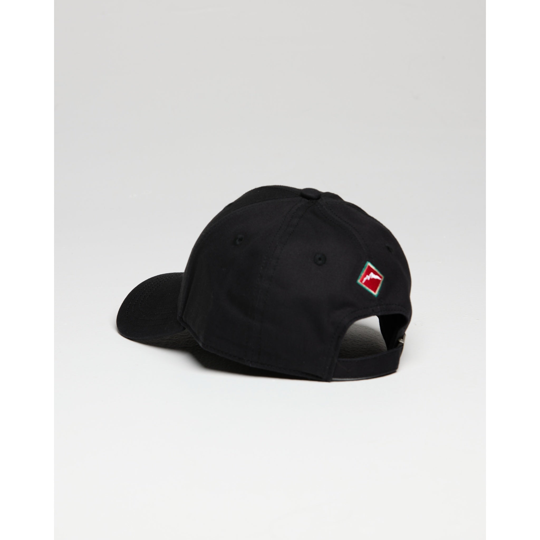 Black cap with a logo on the back against a light gray background