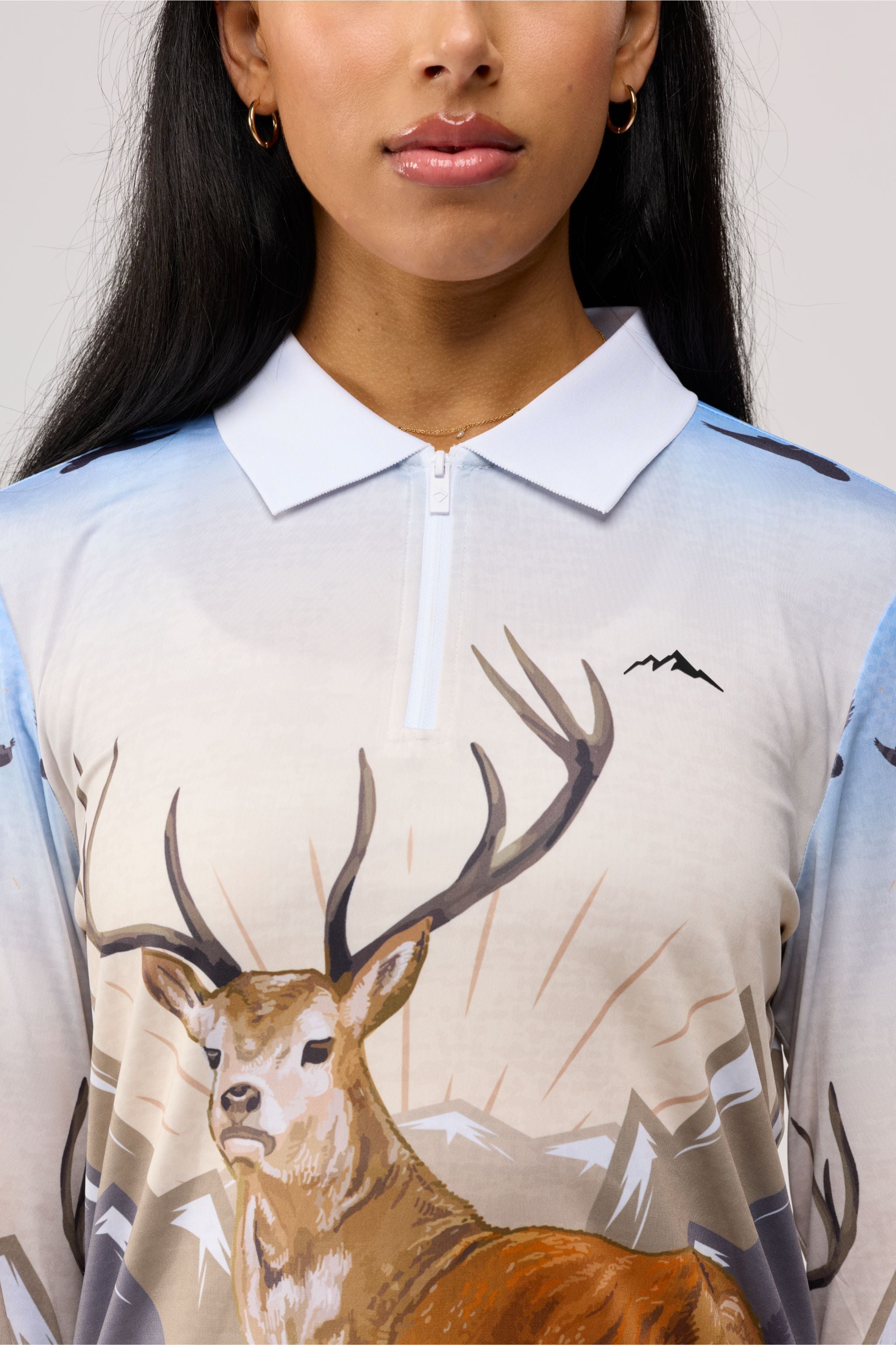 Close-up of women’s hunting camo shirt pattern highlighting realistic camo print.
