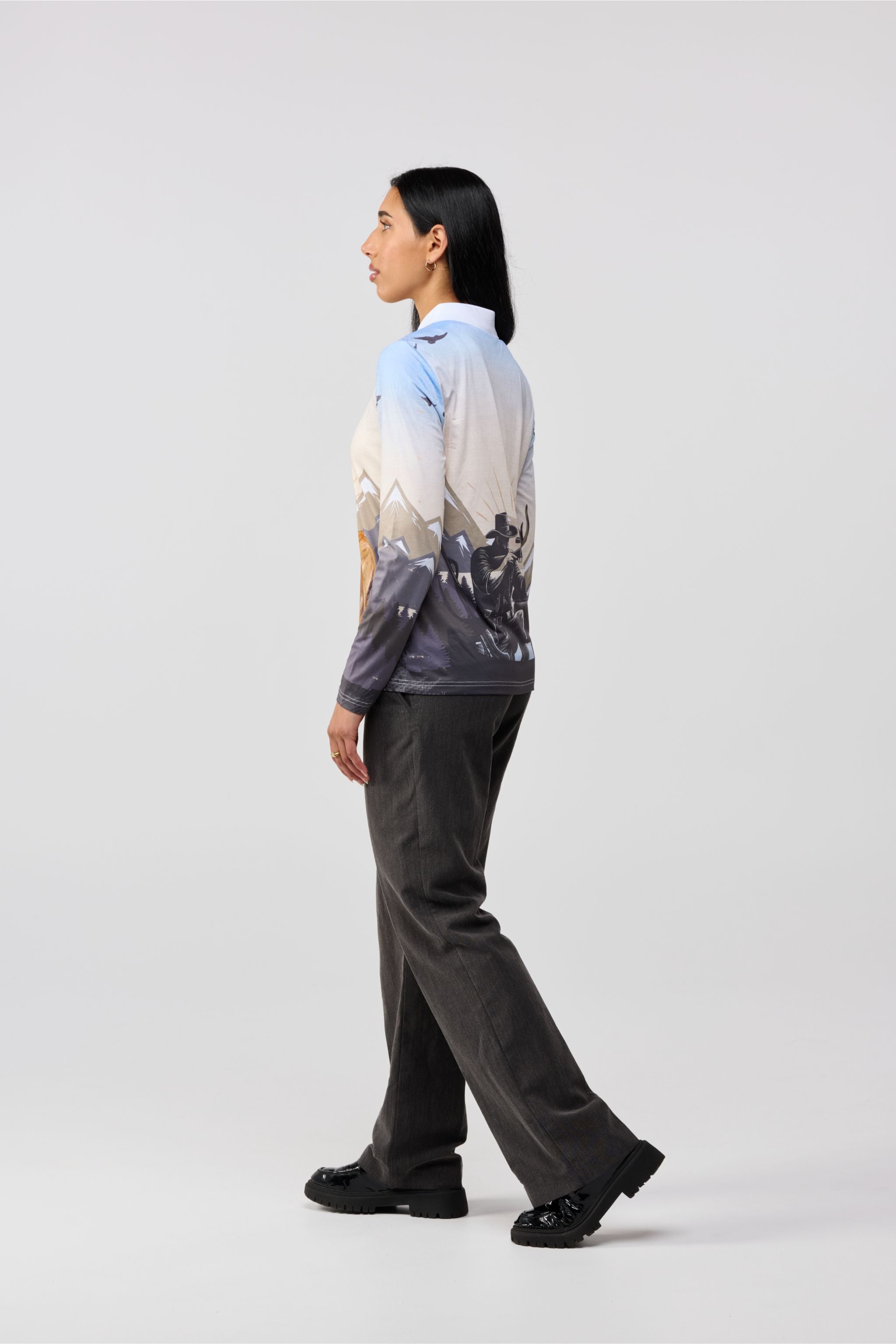 Side profile of women’s hunting camo performance shirt with fitted cut.